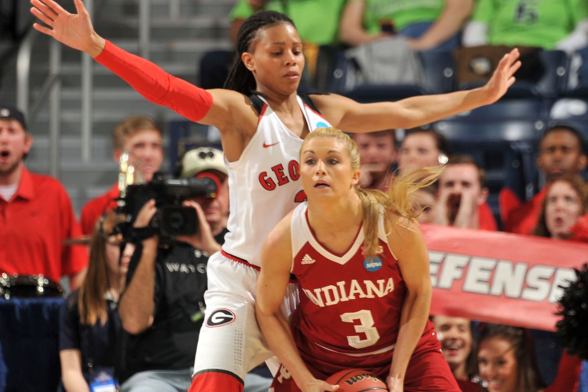 Tyra Buss driving to the basket in an Indiana uniform