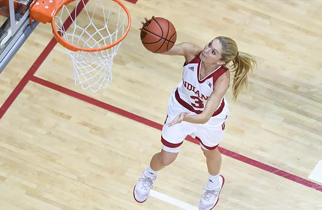 Tyra Buss in an Indiana Hoosiers uniform finishing at the basket